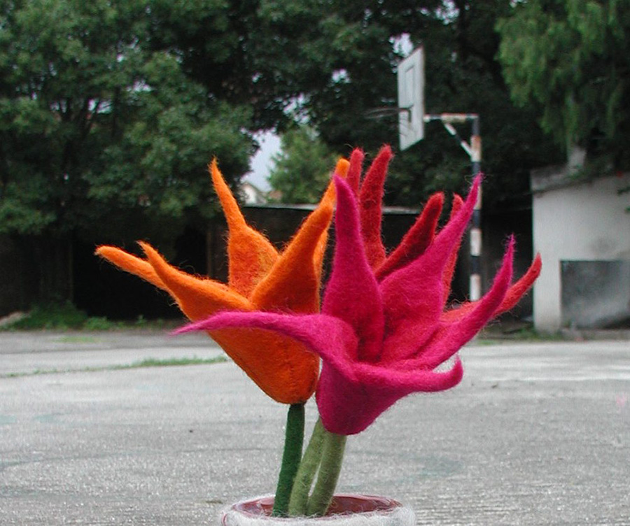 Orange and pink sculptural felt flowers